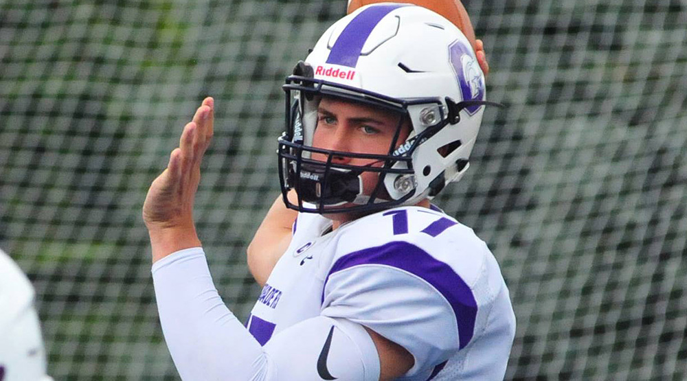 Capital quarterback Thomas Wibbeler, with his arm cocked to throw. (Capital athletics photo by Jamie Gaffney)